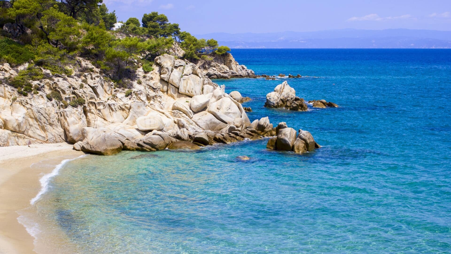 Swim in the translucent coves of Ammouliani Island