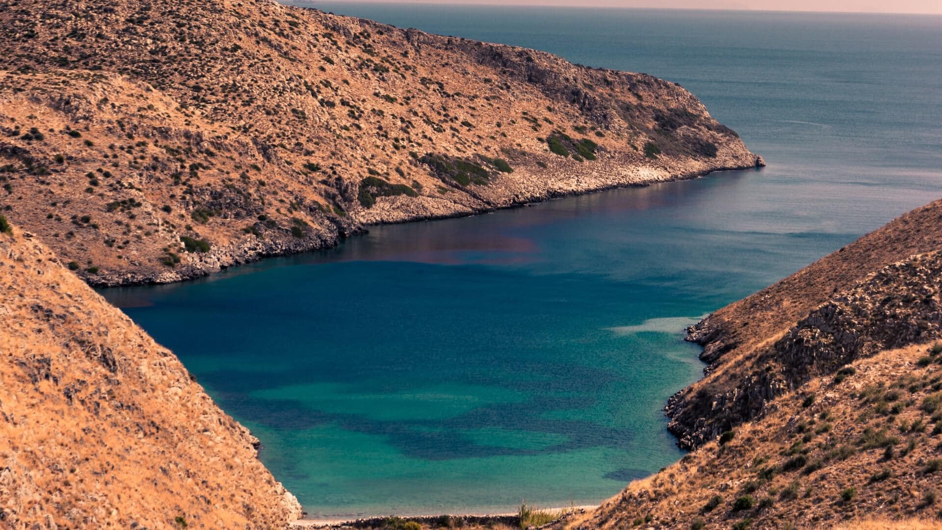 See Elafonisos’ double beach from both sides of the yacht.